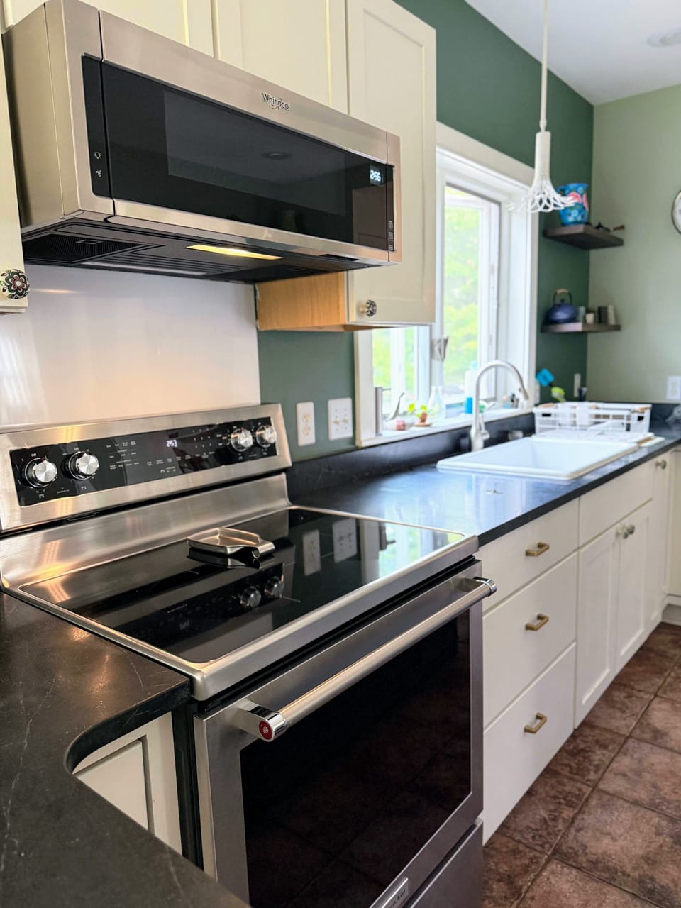New stove and microwave in large kitchen
