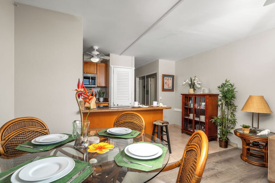 Dining Area with Stylish Table Setting for Four & Kitchen View