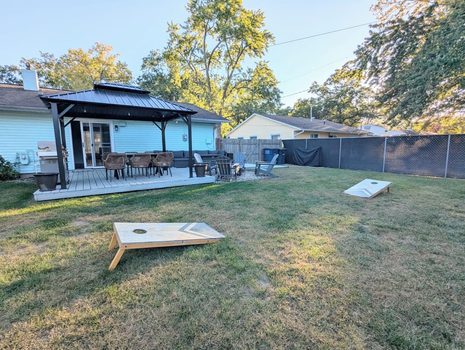 Enjoy friendly competition with tetherball and cornhole on the lush backyard lawn, fun for kids and adults alike!