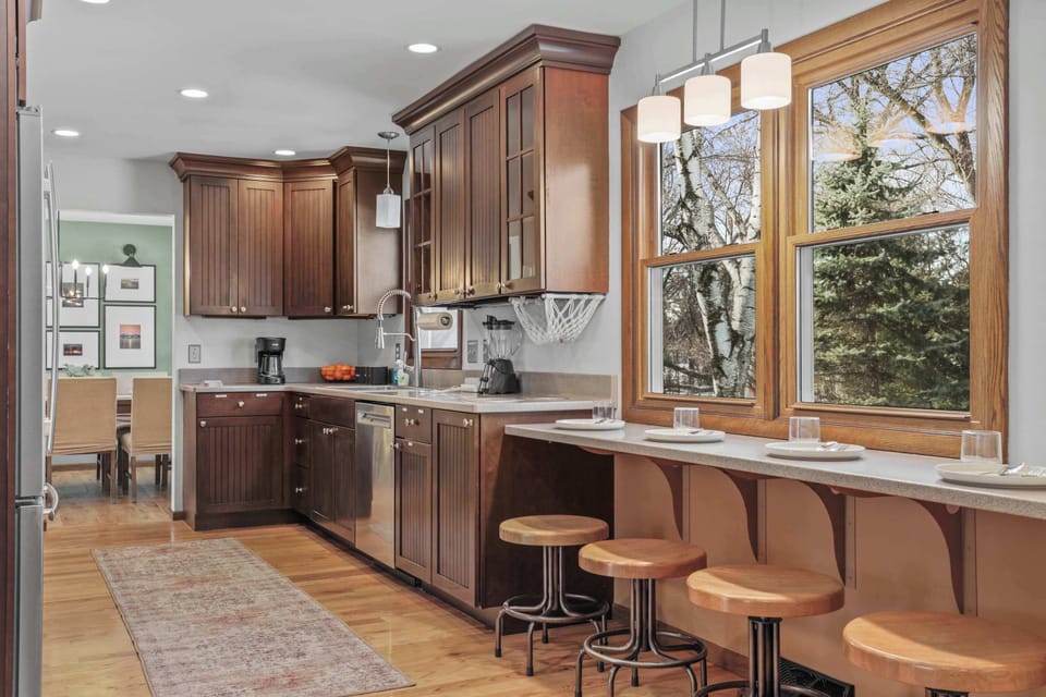 Fully stocked kitchen, with 4 barstools overlooking the backyard. We have a children's clip on high chair, kids dinnerware, complimentary coffee, tea, sugar, and creamer, as well as all your cooking needs on site.