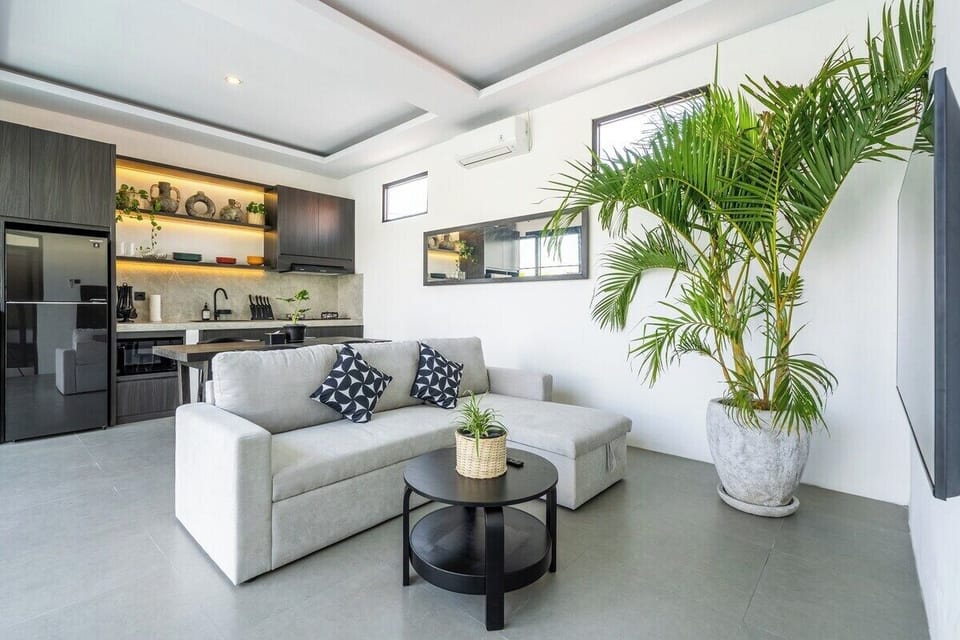 The living room at The R Villa Dempo blends style and comfort, making it perfect for fun times with friends. #The R Villa Dempo