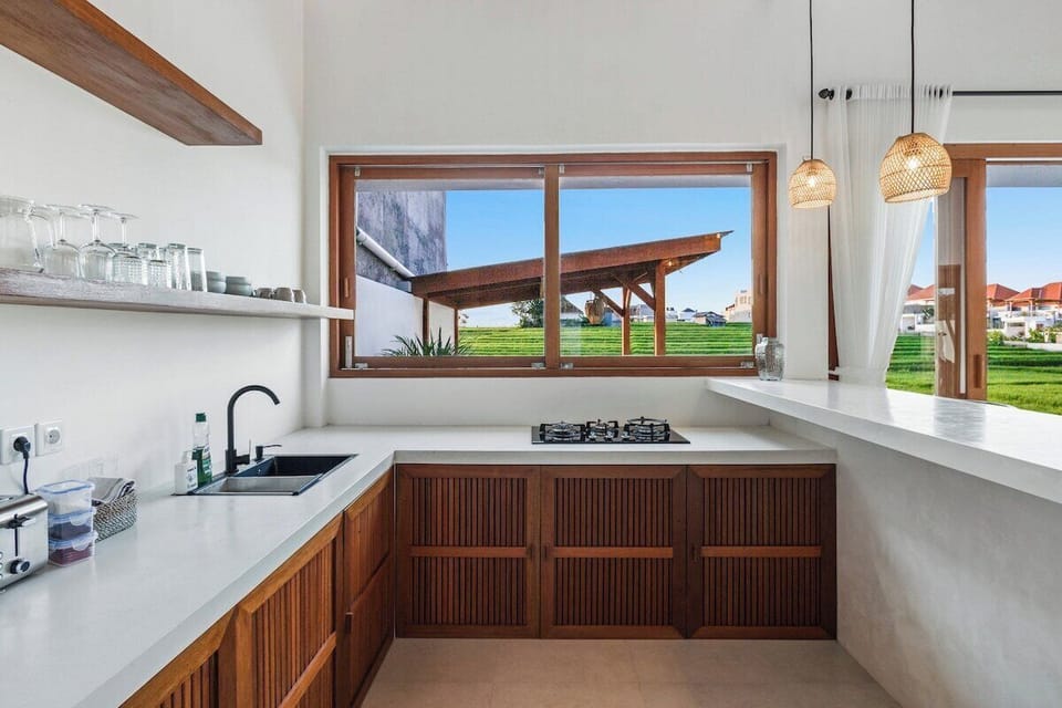 A bright, modern kitchen with top-tier appliances, clean lines, and an open layout designed for effortless cooking and entertaining. #Villa Swantika
