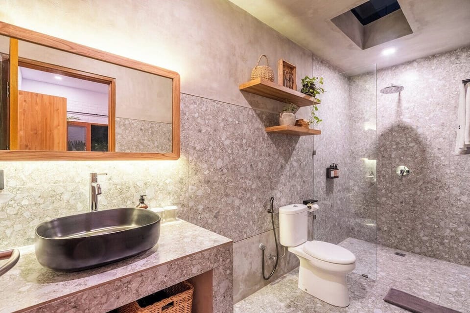 Revitalize in Villa Samalas's bathroom—a stylish sanctuary blending modern design with Balinese tranquility. #Villa Samalas