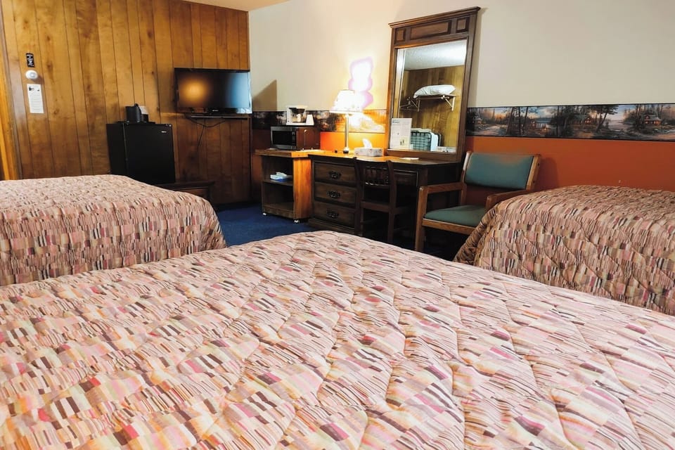 Settle in with comfy beds, TV entertainment, and in-room fridge