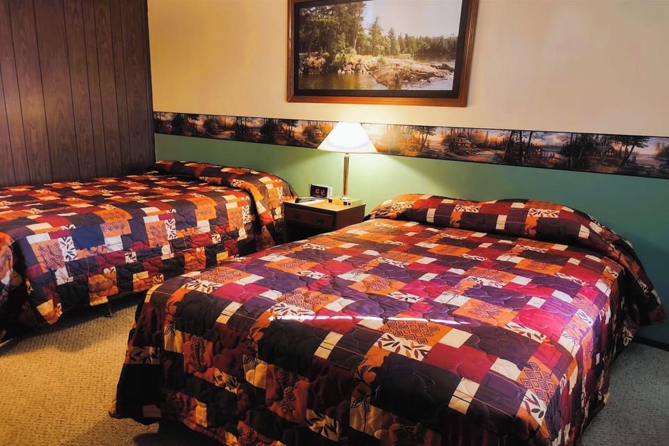 Drift off on plush beds beneath calming, cabin-inspired decor