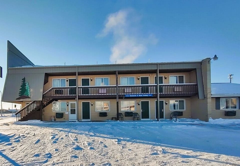 Arrive to a classic lodge exterior with easy access parking.