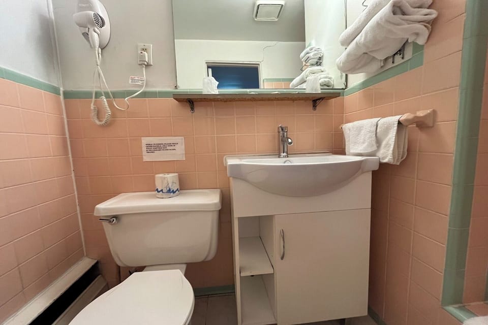 Freshen up easily with tidy vanity and bright lighting.