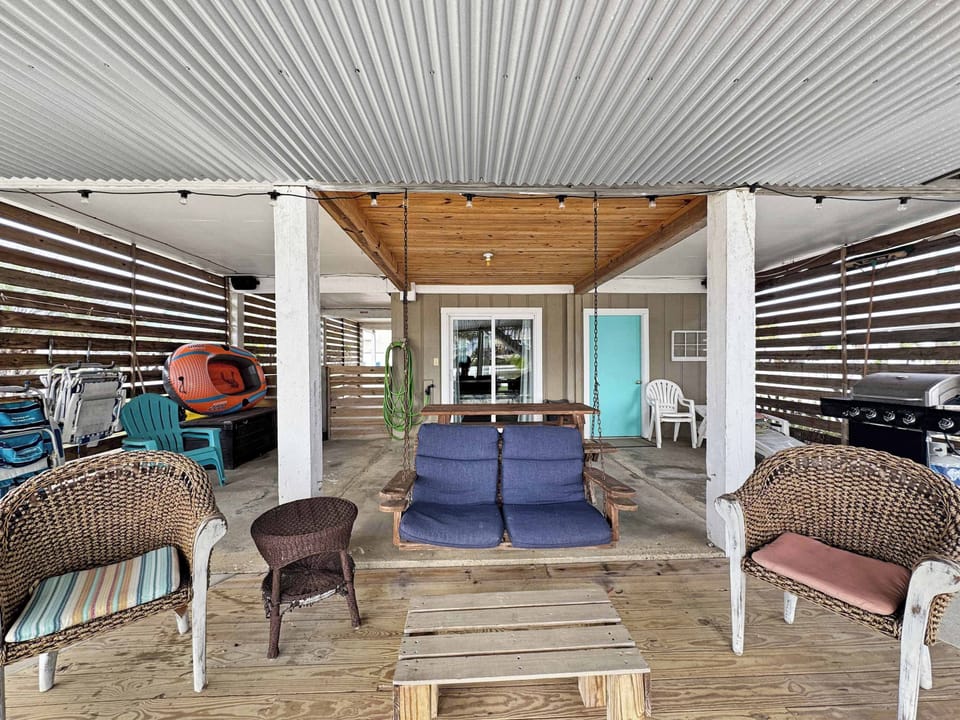 Patio days done right—swing, BBQ, and relaxation included! 