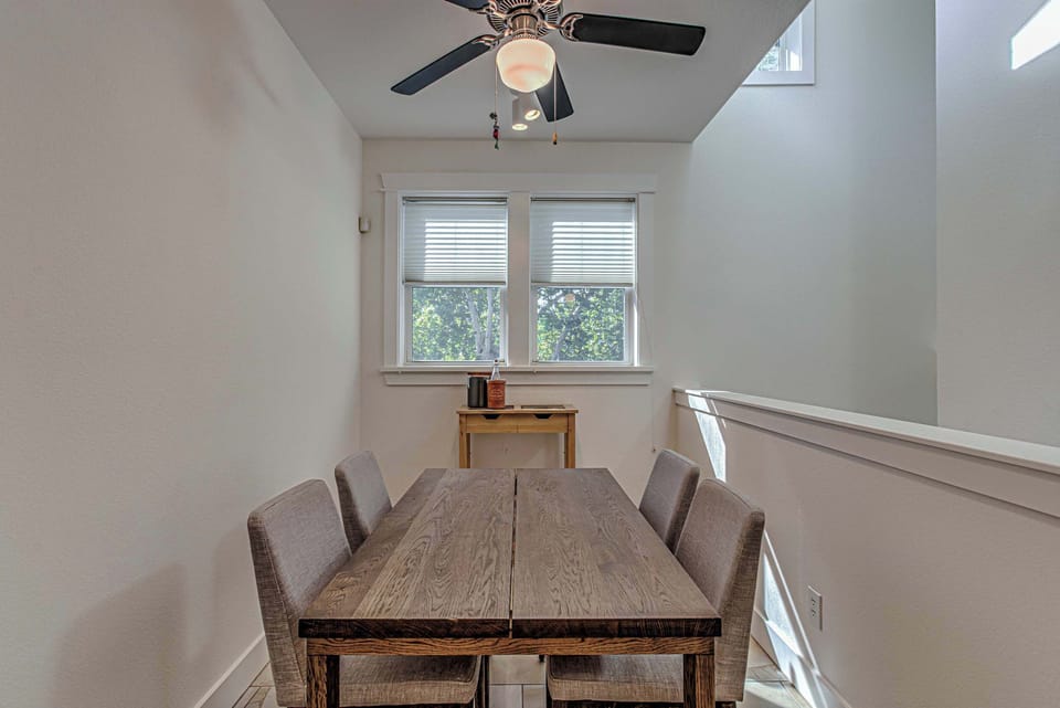 Dedicated dining space for four with a stylish ceiling fan.