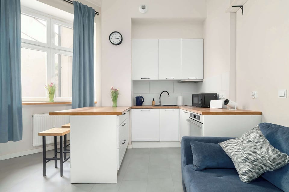 The large kitchenette window lets in plenty of natural light, creating a perfect spot for a morning coffee.