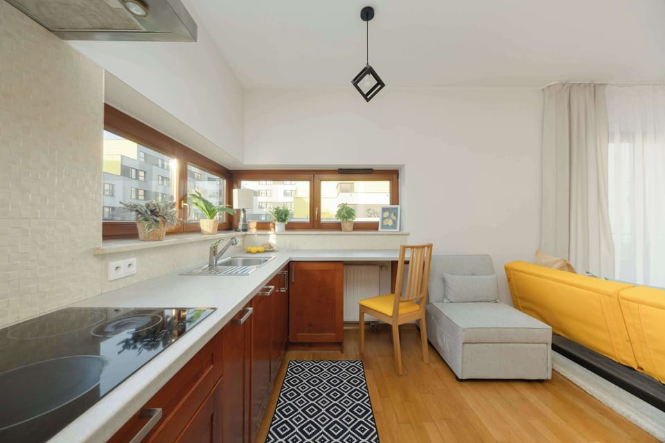 Bright kitchen with a wide countertop and a cozy breakfast corner.