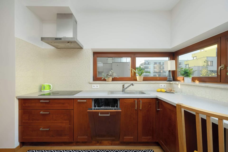 Windows letting in natural light to the kitchen and dining area.