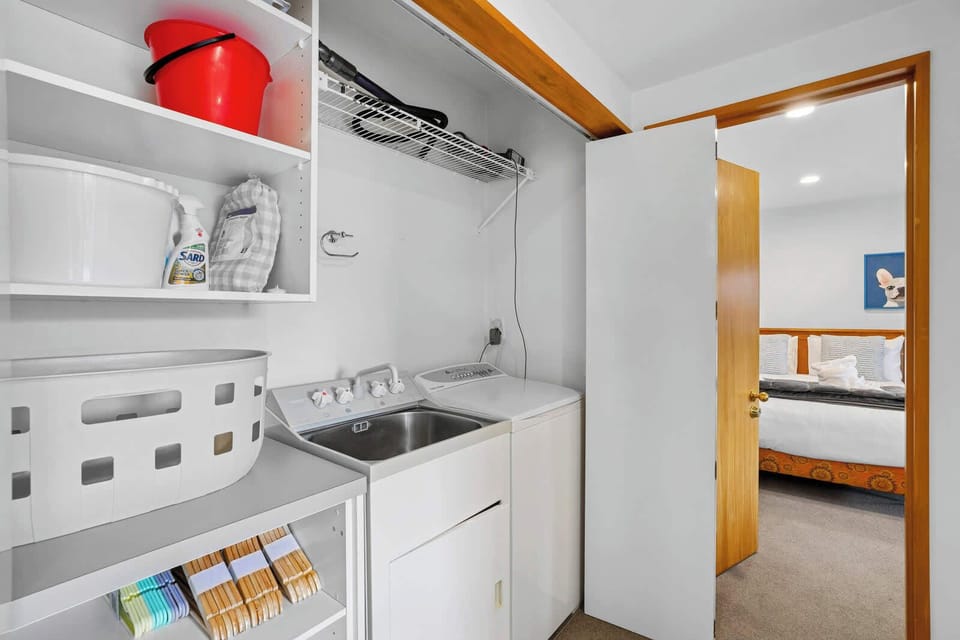 Compact laundry area with essentials provided