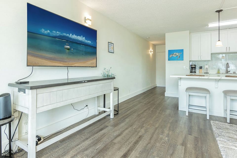 Cook, sip, and stream in open-concept living made easy