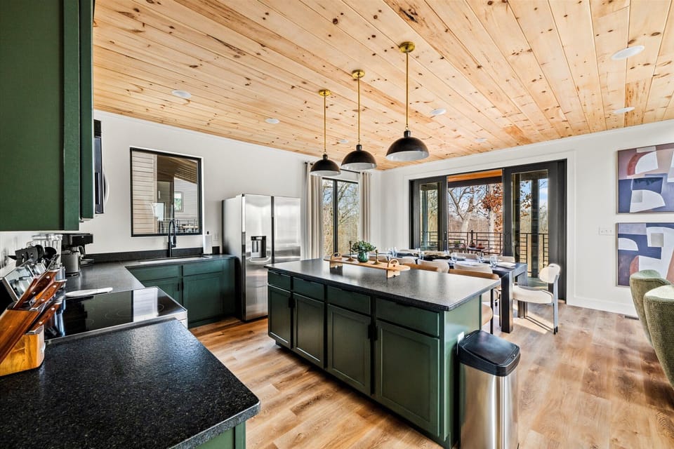 5 Bedroom Rooftop Cabin with Hot Tub Indoor pool at Lodges at Re - Main level: living room, with modern, open kitchen, dining and living room. Living Room features gas fireplace, large SMART TV, and Wifi