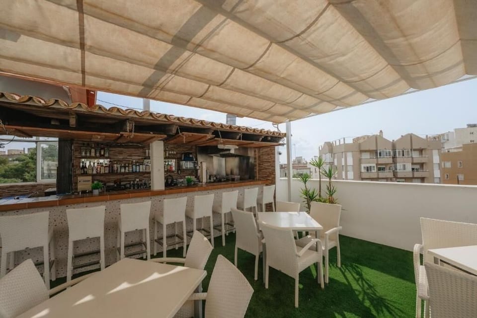 Gather for sunset drinks on the breezy rooftop terrace.