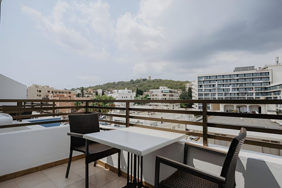 Sip coffee outdoors while the cityscape stretches ahead.