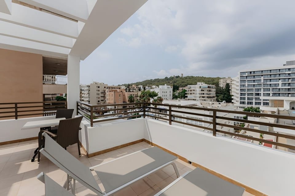 Soak up sunshine on loungers with sweeping hillside views.