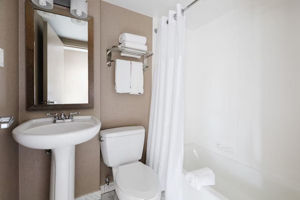 Refresh after adventures in a spotless bath with fresh towels.