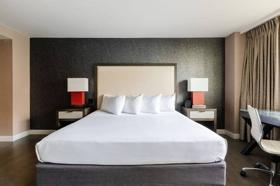 Sink into a plush king bed for effortless, quiet sleep.