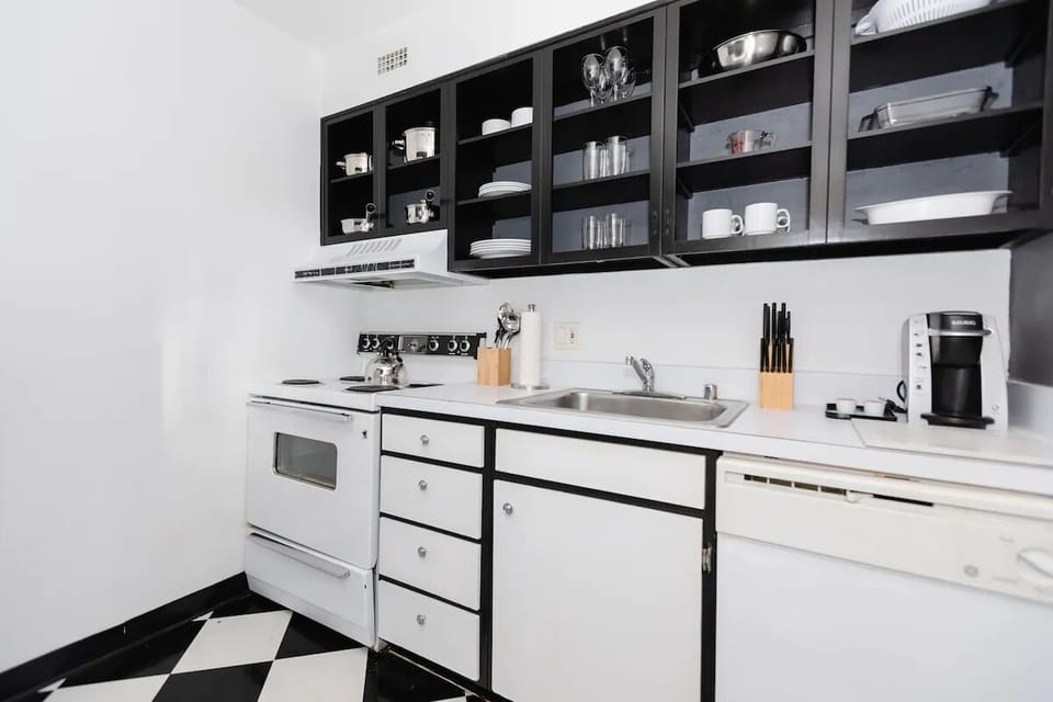 Cook with ease in the bright kitchen stocked for quick meals.