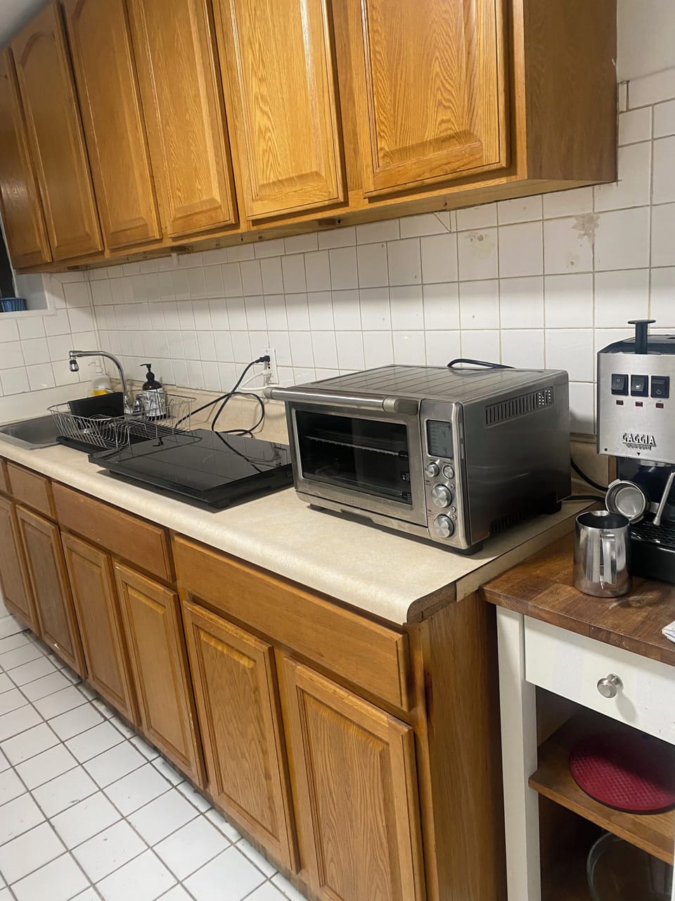 Kitchenette with two burner induction cook top, toaster oven, espresso machine