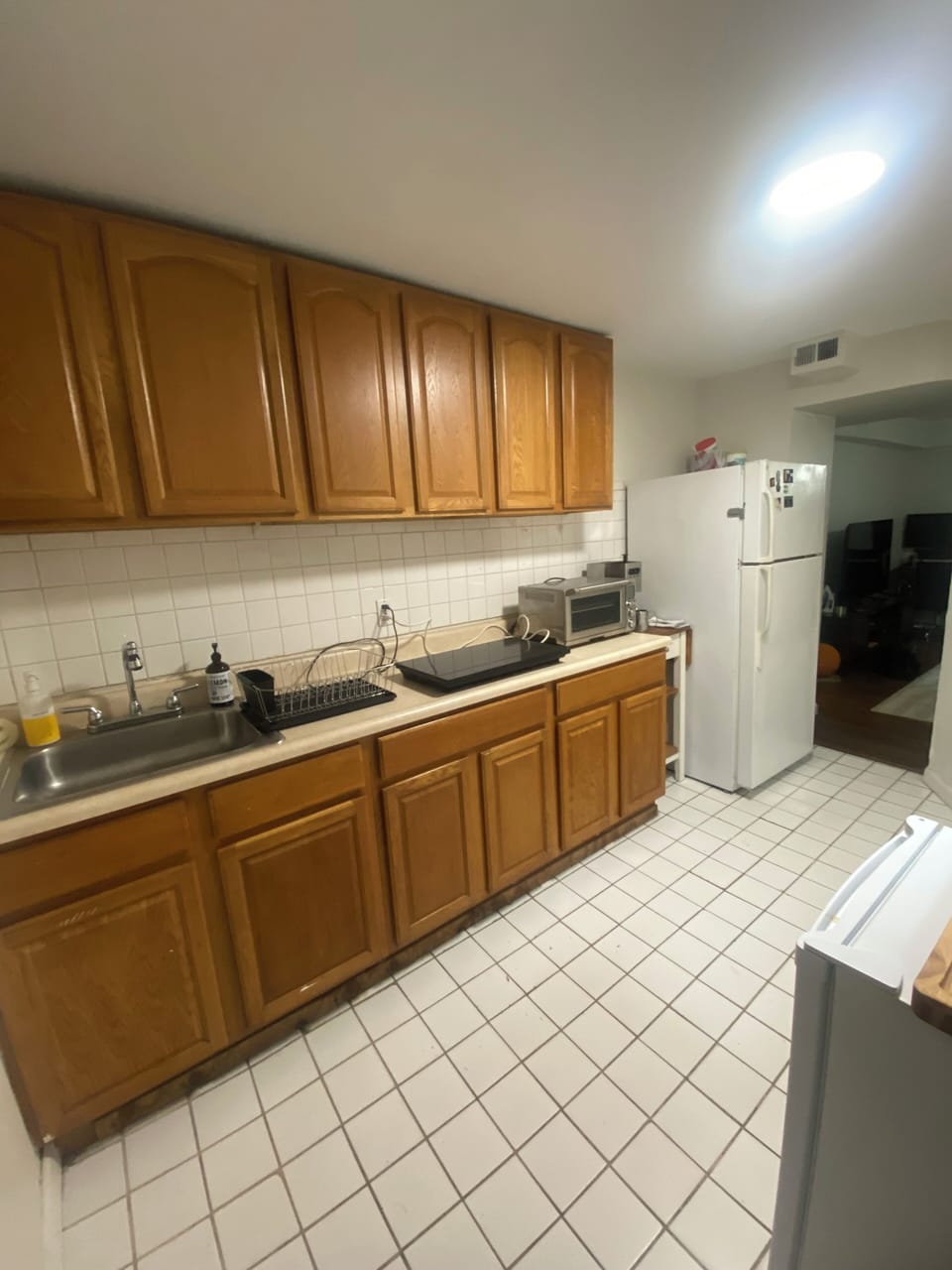 Kitchenette with two burner induction cook top, toaster oven and fridge/freezer