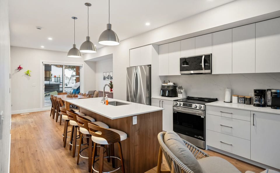 Full kitchen with a drip & keurig coffee machine, air fryer and a hand mixer.