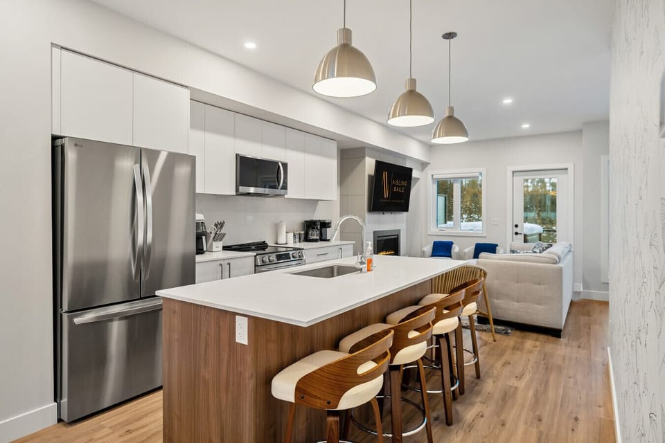 Full kitchen with a drip & keurig coffee machine, air fryer and a hand mixer.