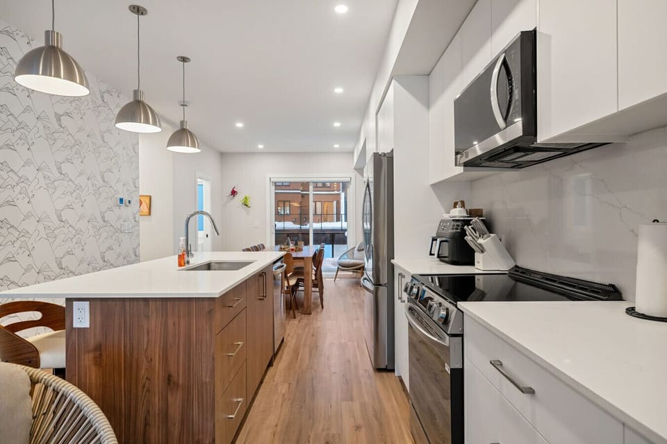 Full kitchen with a drip & keurig coffee machine, air fryer and a hand mixer.