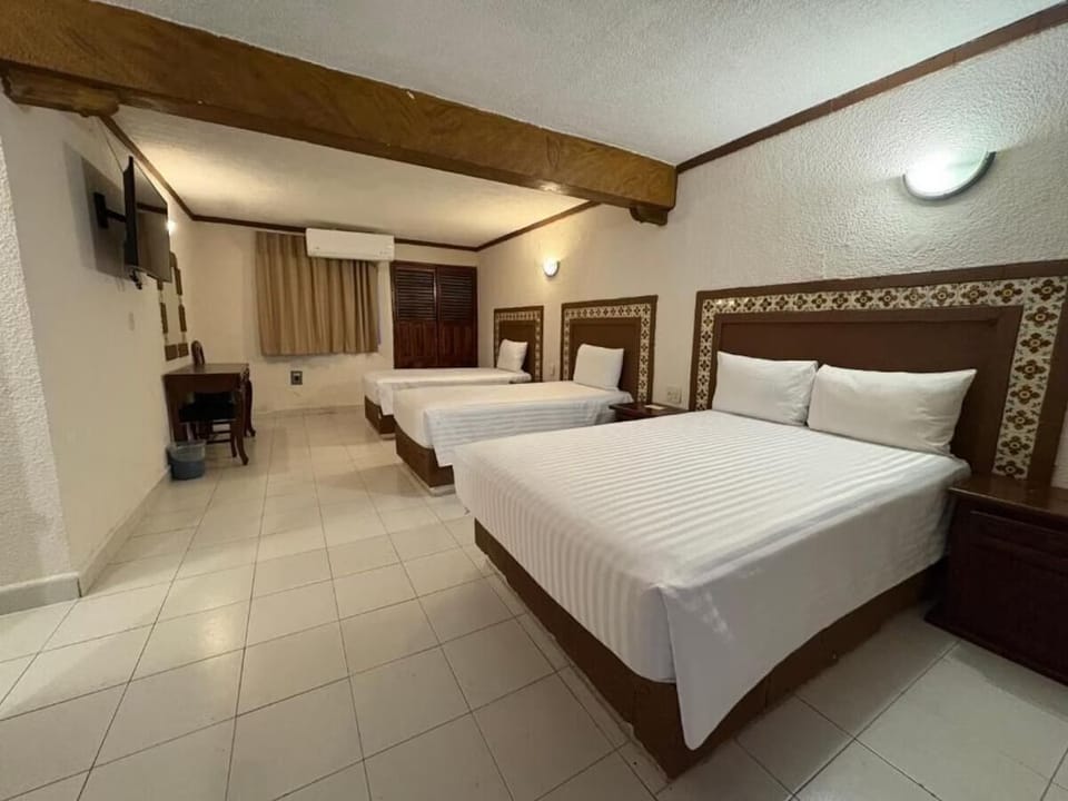 Unwind together in a spacious triple room with cool A/C.