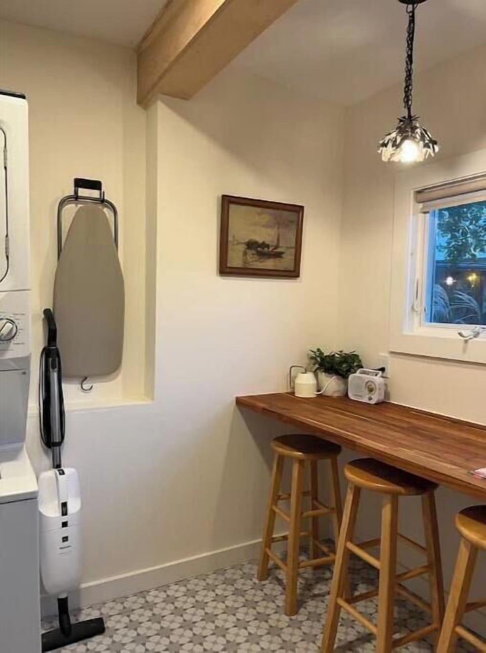 Laundry area with bench and can be use as a office space