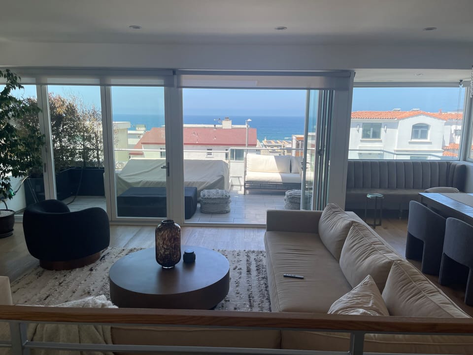 Living room with access to deck and ocean view