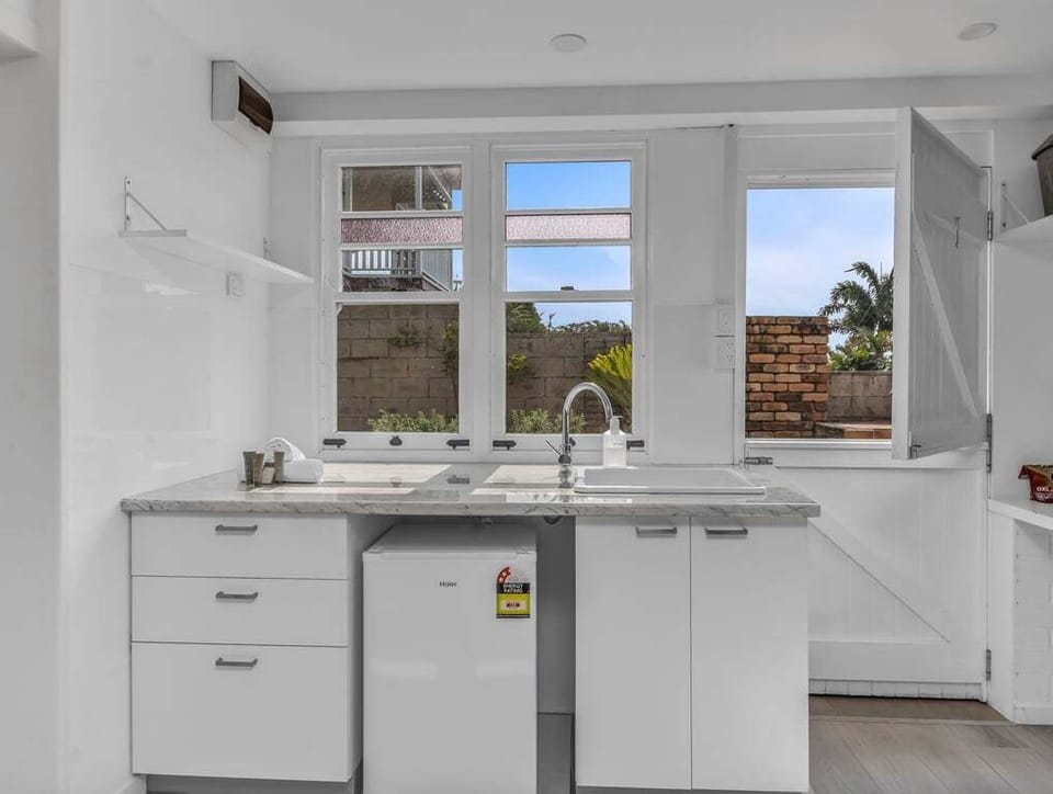Bright and organized sink space in the kitchen.