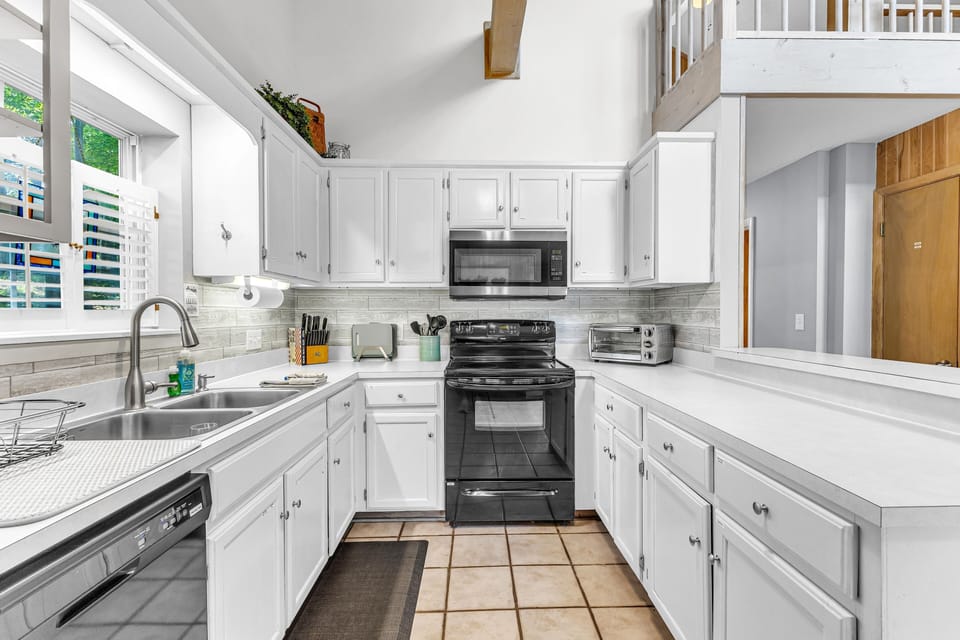 Well-stocked kitchen with open layout and plenty of space to cook together.