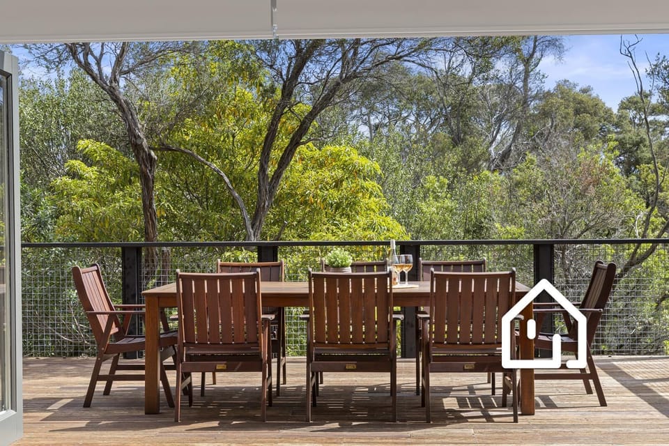 Upper deck with soaring treetop vistas, located off the kitchen
