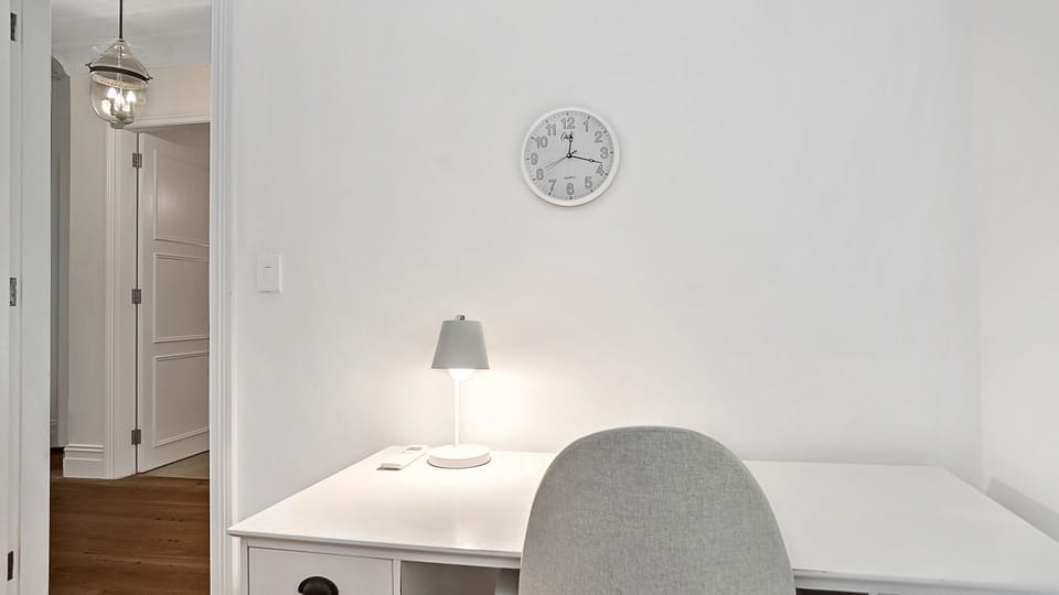 Bright study nook with desk and lamp