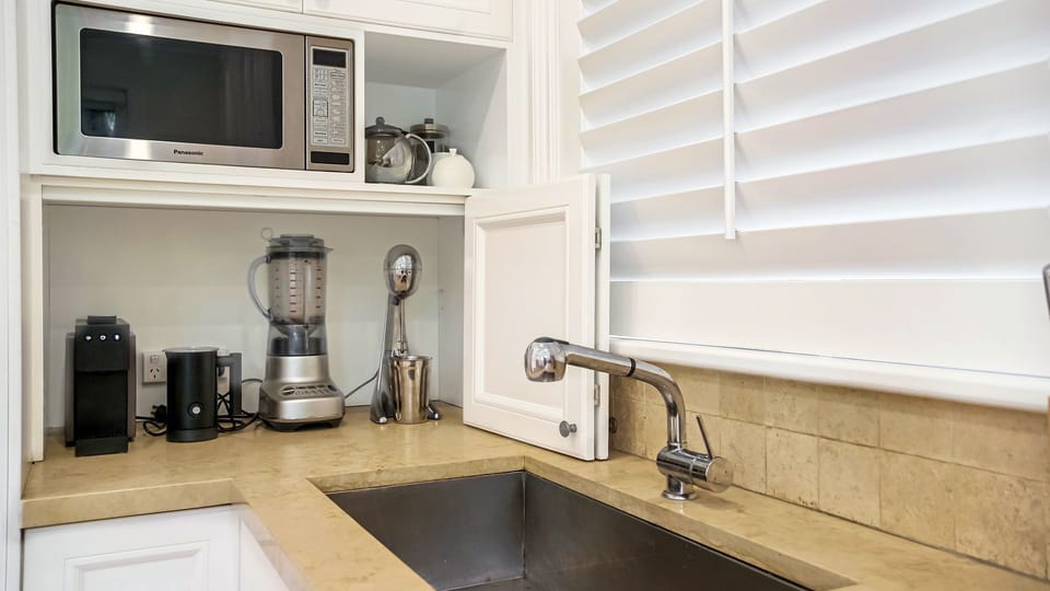Compact kitchenette with coffee machine and essentials