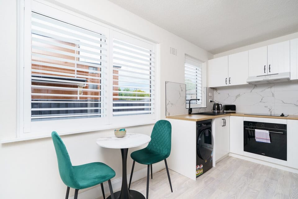 Light-filled dining nook that invites you to linger over meals or plan your day with a map spread out.
