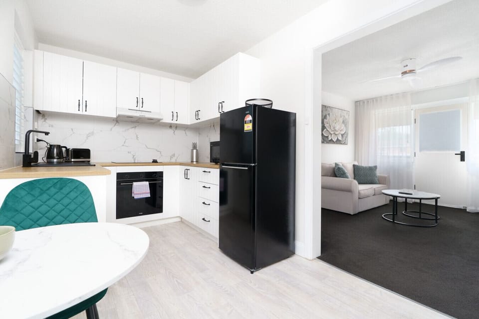 A crisp, modern kitchen with everything you need light, bright, and ready for your culinary moments