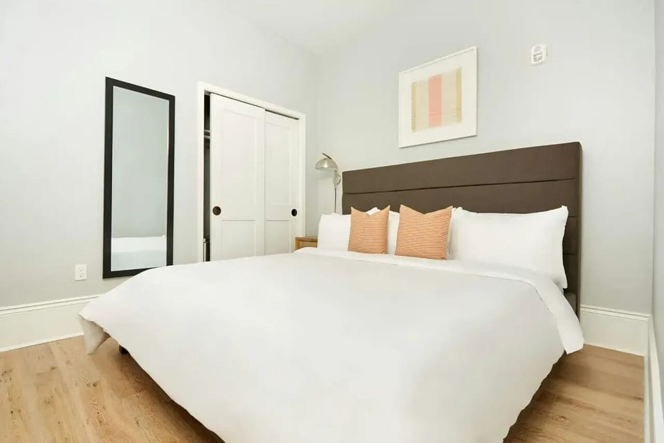 Bedroom 1 features a queen bed.