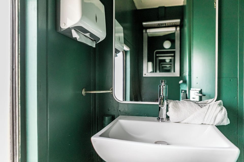 First bathroom located inside train car.