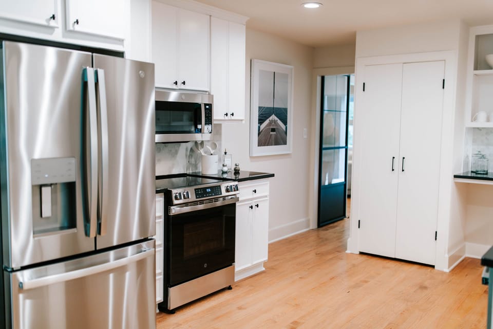 Fully equipped kitchen with stainless steel appliances and plenty of storage space.