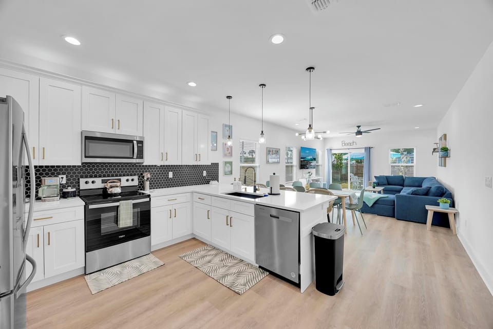 Kitchen - chef-ready kitchen stocked with everything you need: cookware, utensils, small appliances, coffee bar and bar seating for 4.