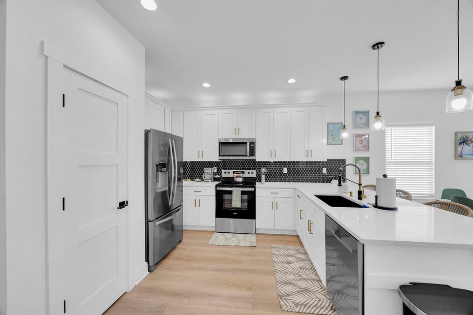 Kitchen - chef-ready kitchen stocked with everything you need: cookware, utensils, small appliances, coffee bar and bar seating for 4.