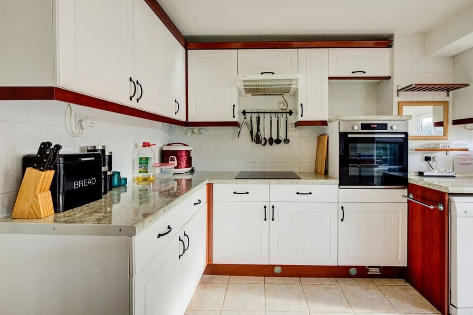 Full kitchen with oven and essentials