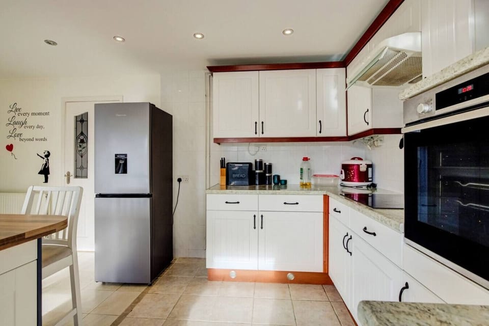 Kitchen with fridge and water dispenser