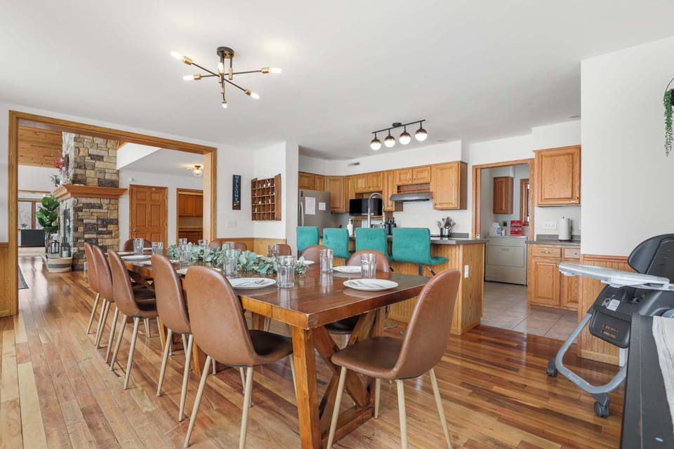 Dining table that seats 12, with 4 barstools in the kitchen, and 6 extra chairs with a fold up table. As well as a rolling high chair.