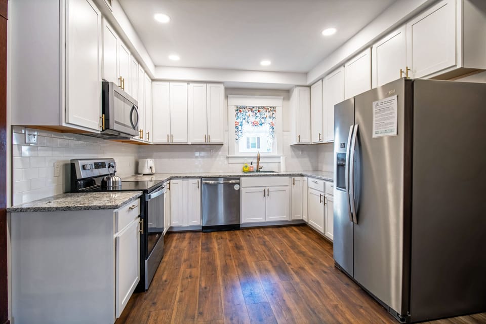 Full kitchen with stove top, oven, microwave, refrigerator, dishwasher, and more!