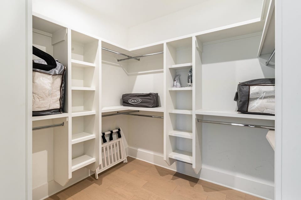 3rd Floor: Primary bedroom with a King bed, smart TV, large walk-in closet, and en-suite bathroom.